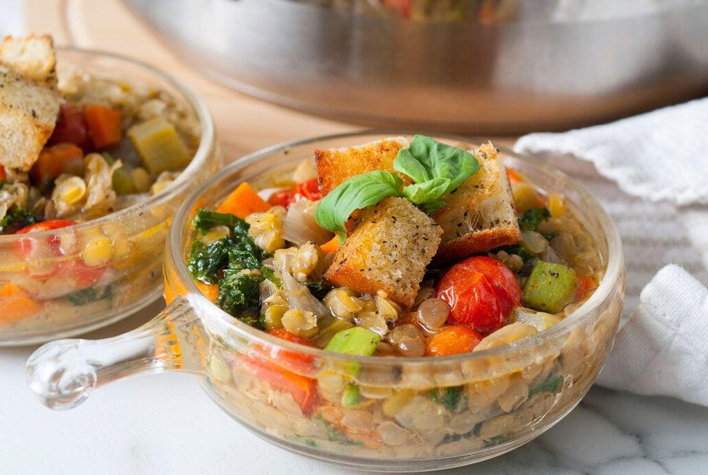 Lentil soup in a bowl with a spoon.