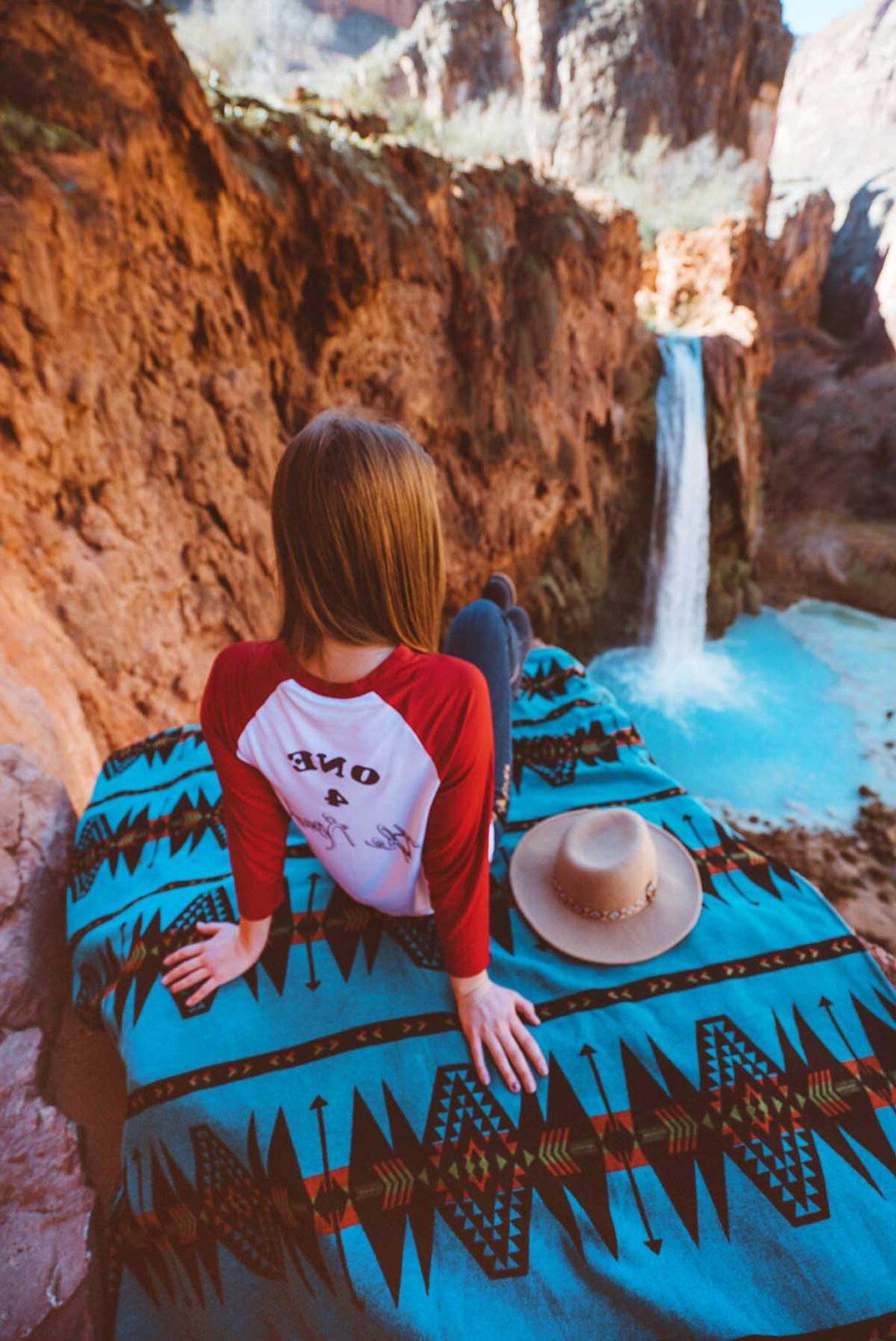 A woman at a waterfalls. 