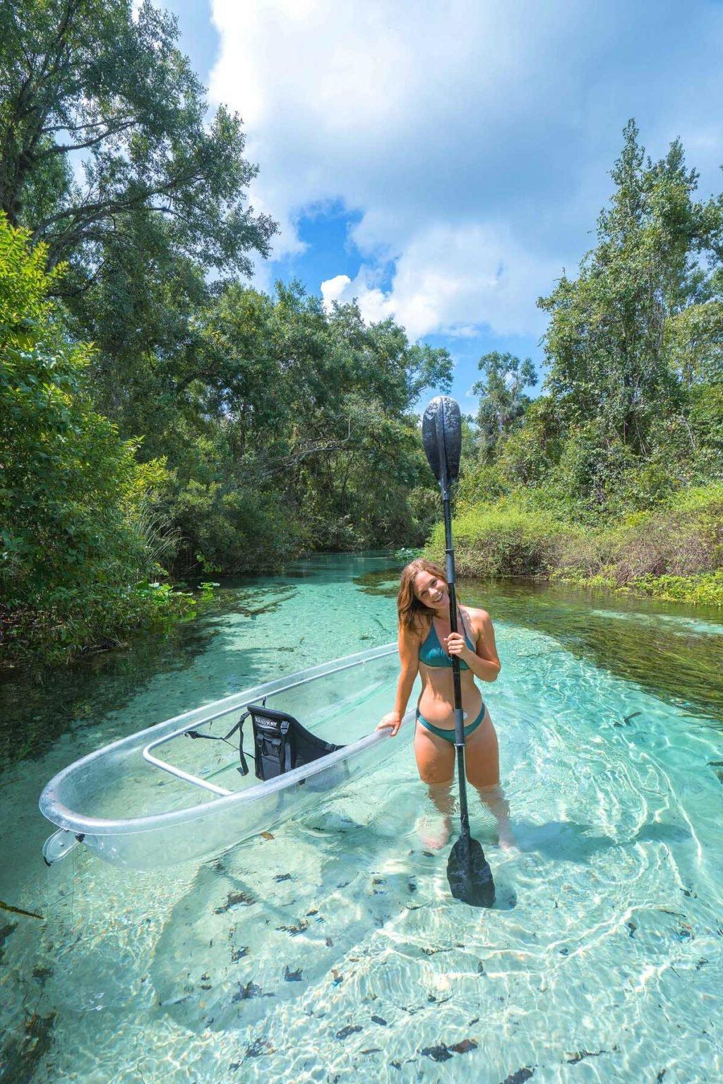 A woman with a clear kayak in Florida.