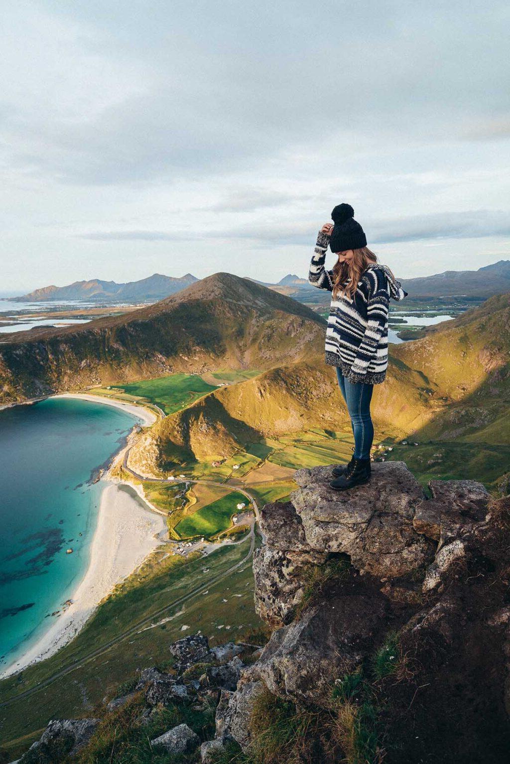 Woman standing on a mountain top in Norway.