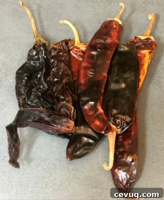 Συνταγή Τσίλι Κατσαρόλας 6 dried Mexican chiles on a counter