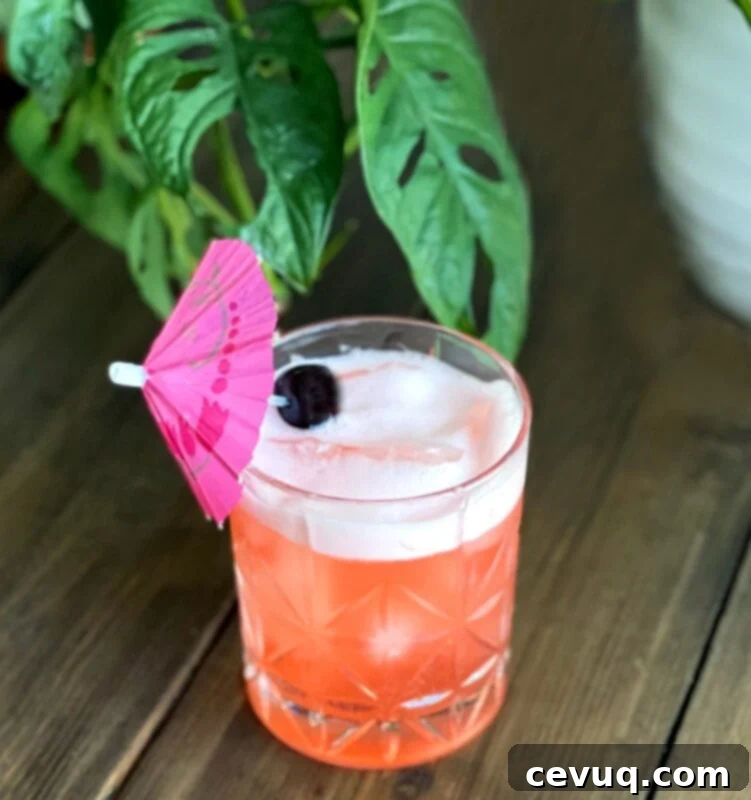 Τζιν Τίκι Ελιξίριο 3 Τροπικό orgeat gin κοκτέιλ με μια μικρή ομπρέλα