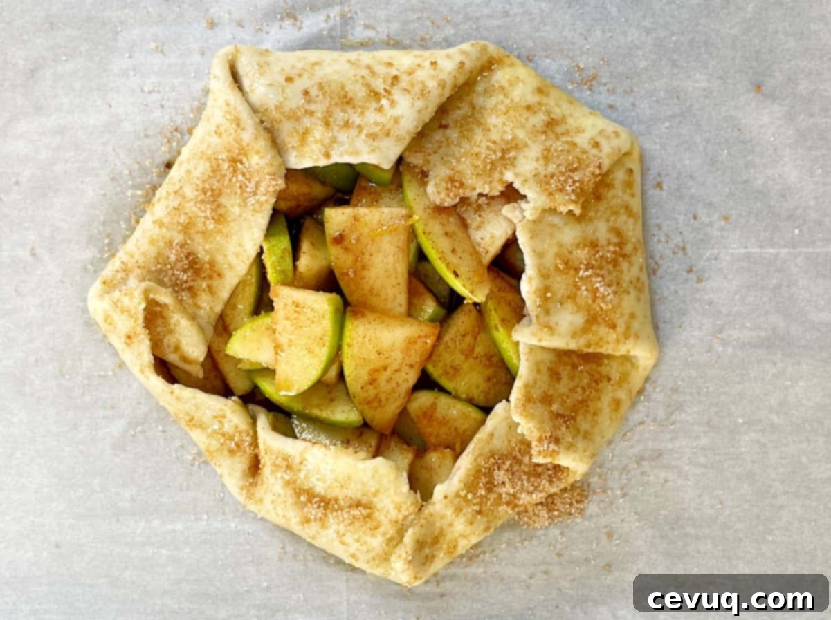 Γκαλετάκια Μήλου 8 επάλειψη αυγού και ζάχαρη σε άψητη τάρτα μήλου.