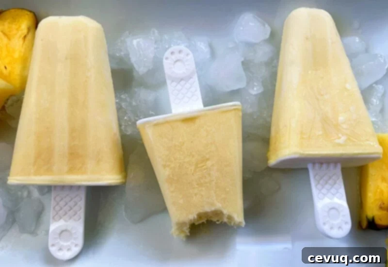 Δροσερό Ξυλάκι Ανανά 6 three pineapple popsicles with a bite taken out of one