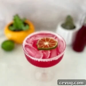 Μαργαρίτα Φραγκόσυκο 9 prickly pear margarita with dried lime wedge garnish.