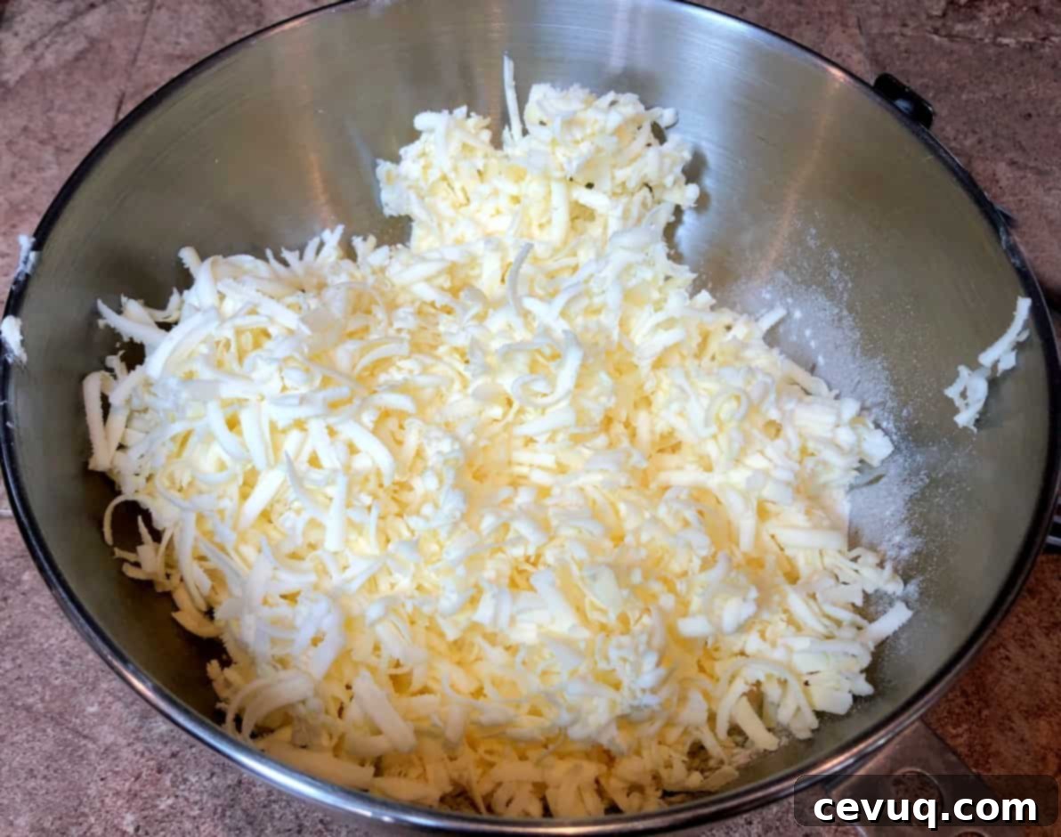 Γρήγορη και Εύκολη Σφολιάτα 5 grated butter in a bowl.