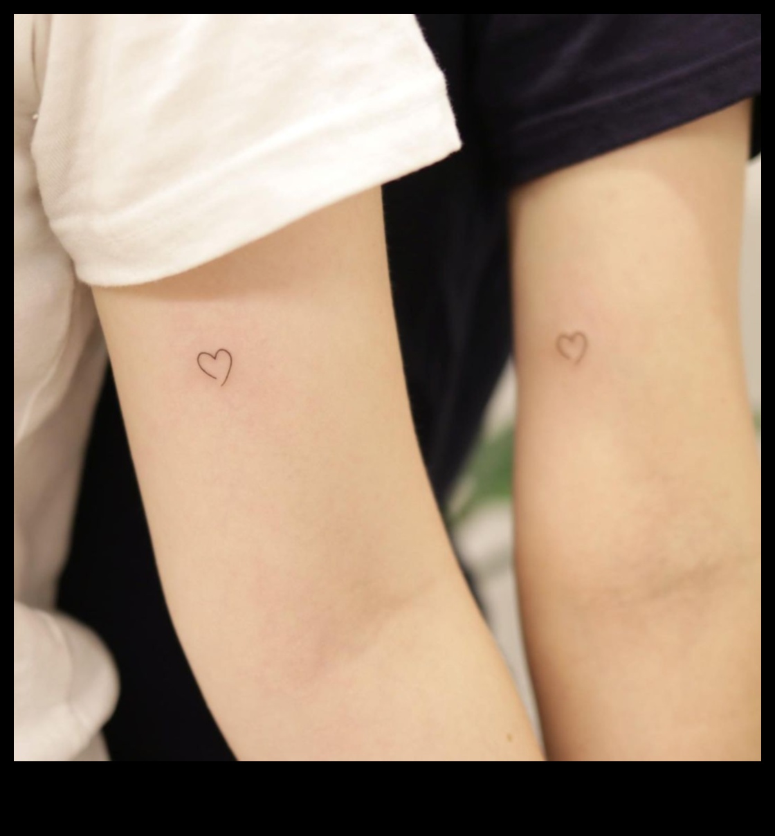 Love's Canvas: Couple Tattoos Painting a Story of Devotion