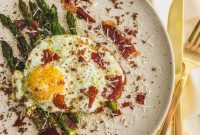 Asparagus with Olive Oil Fried Egg, Brown Butter Breadcrumbs & Crispy Prosciutto