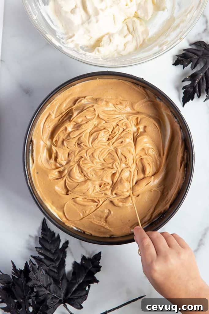 pumpkin caramel cheesecake on a cake pan