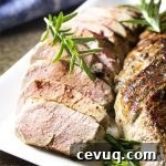 For the best roast pork tenderloin, give the meat a herb rub with rosemary and mustard, sear it in a cast iron skillet, and then finish the roast in the oven until perfectly cooked. Simple, delicious, and juicy! Perfect for a quick weeknight dinner. | justalittlebitofbacon.com #porkrecipes #dinnerrecipes #porktenderloin #porkroast #easyrecipe