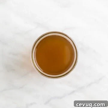 Homemade vegetable broth in a glass jar