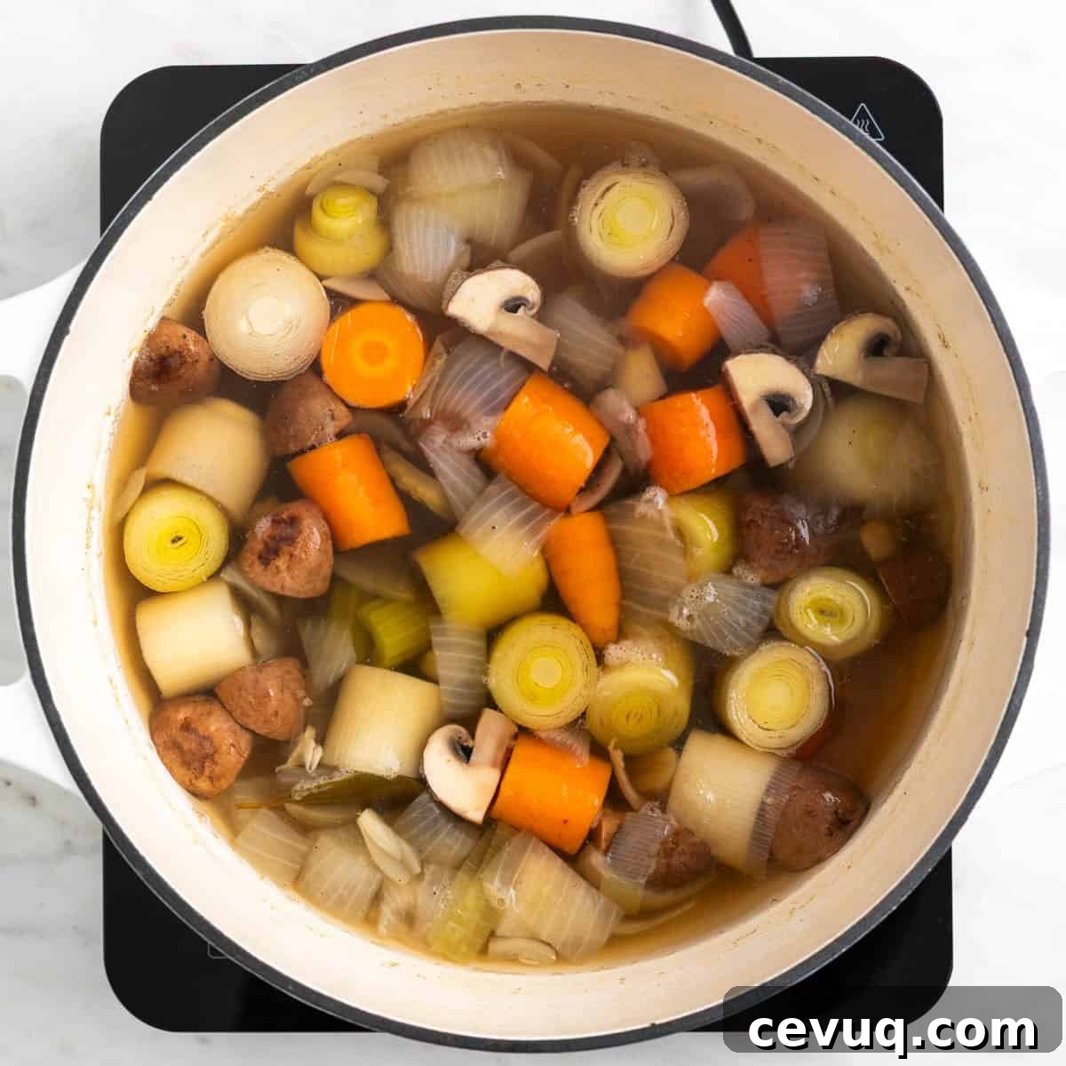 Homemade vegetable broth cooking in a pot