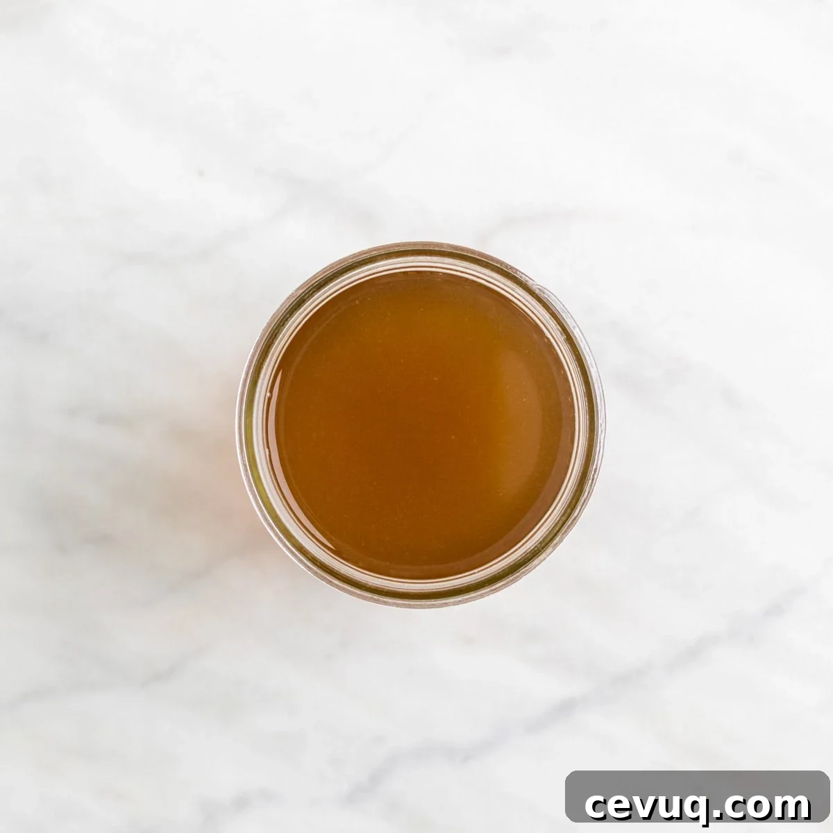 Homemade vegetable broth in a glass jar