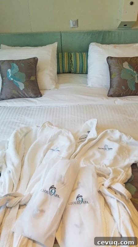 Carnival Sunshine Cloud 9 Spa Stateroom Tour & Review (Video) 3 Cloud 9 spa robes and slippers on the bed