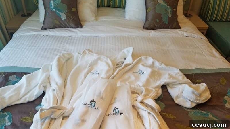 Carnival Sunshine Cloud 9 Spa Stateroom Tour & Review (Video) 4 Cloud 9 robes laid out on the bed