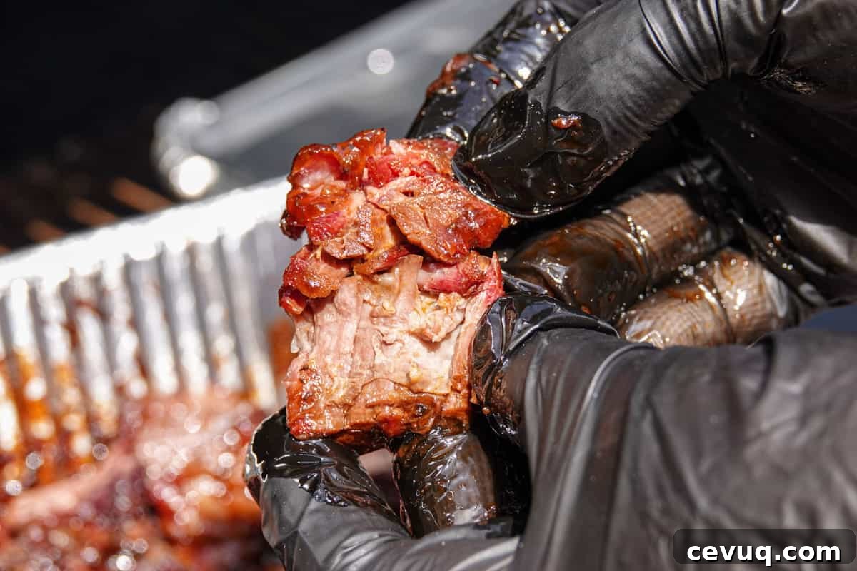 smoked burnt ends ripped apart by hand to show how tender it is