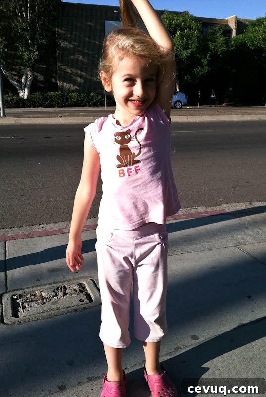 Skylar smiling in pink outfit