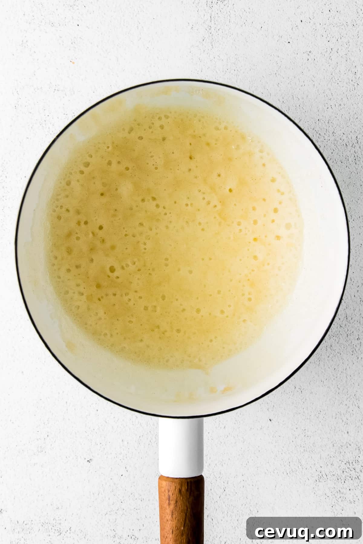 Butter, milk, and flour turning into a roux.