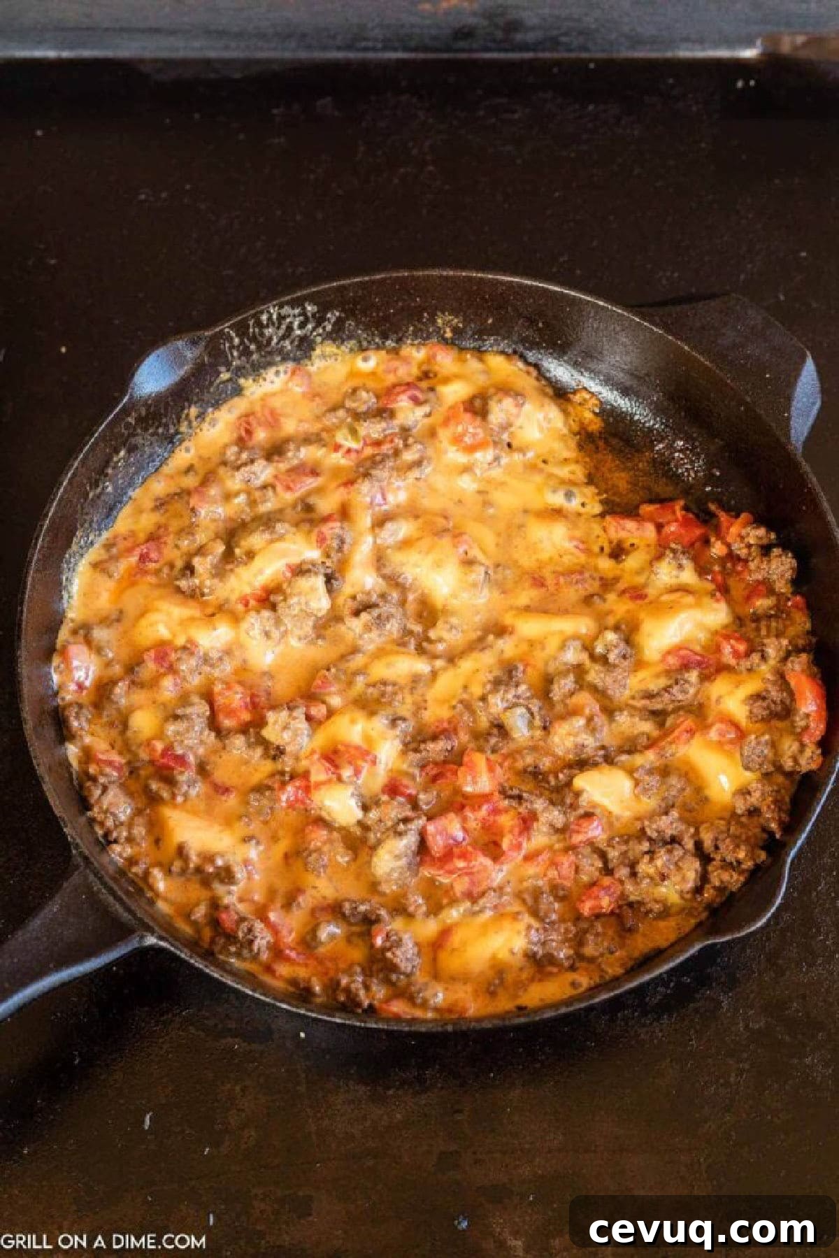 Cheese dip in cast iron skillet on the griddle
