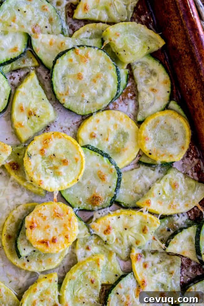 Parmesan Baked Zucchini and Summer Squash Roast 6 Parmesan zucchini and squash on a pan.