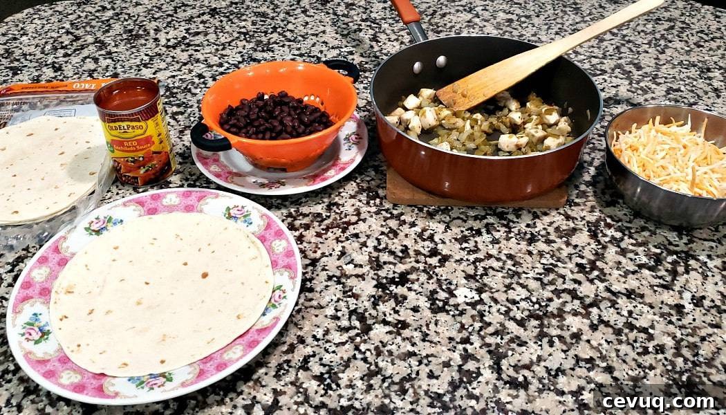 assembly line of enchilada ingredients