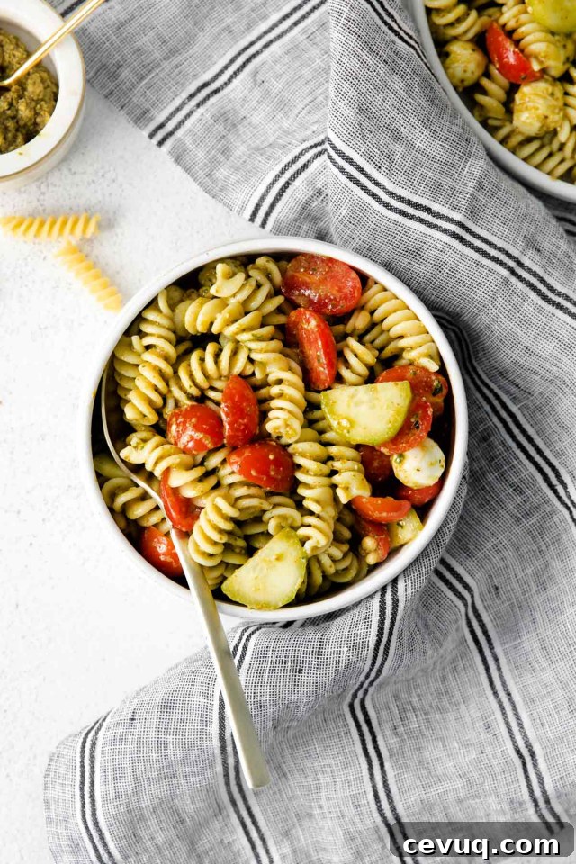 bowl of summer pesto pasta salad on a grey napkin