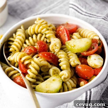 closeup of bowl of summer pesto pasta salad