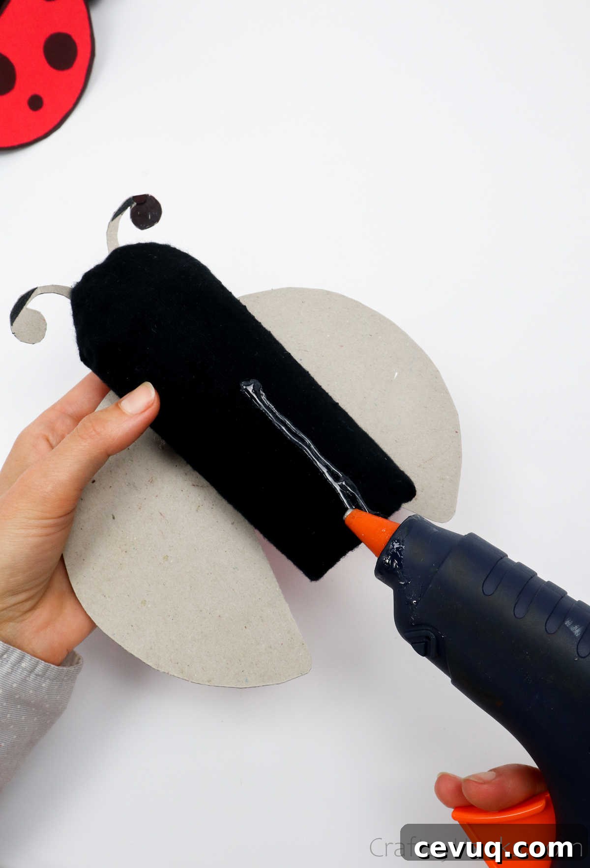 glueing back on ladybug