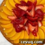 Fruit tart brushed with a fruit glaze.