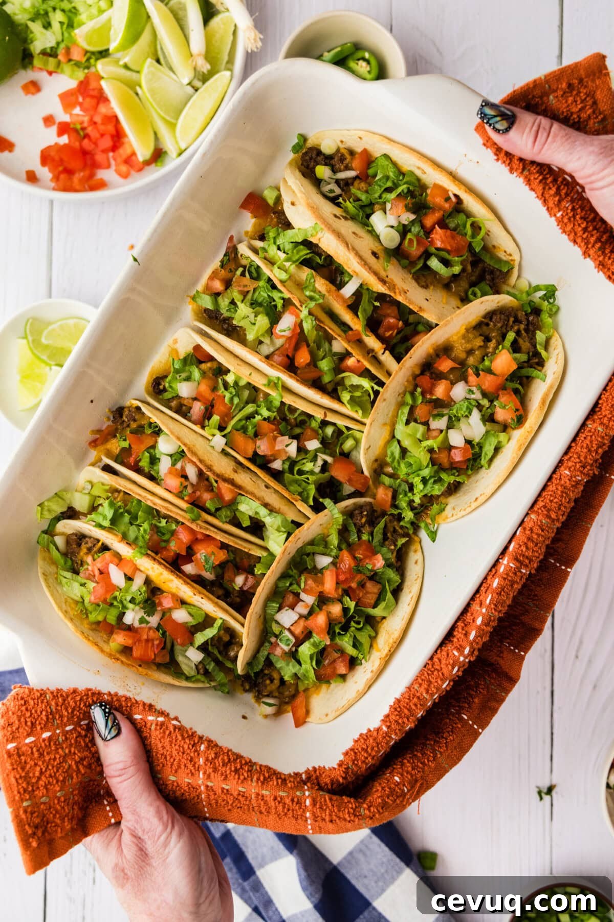 overhead view of oven tacos with toppings
