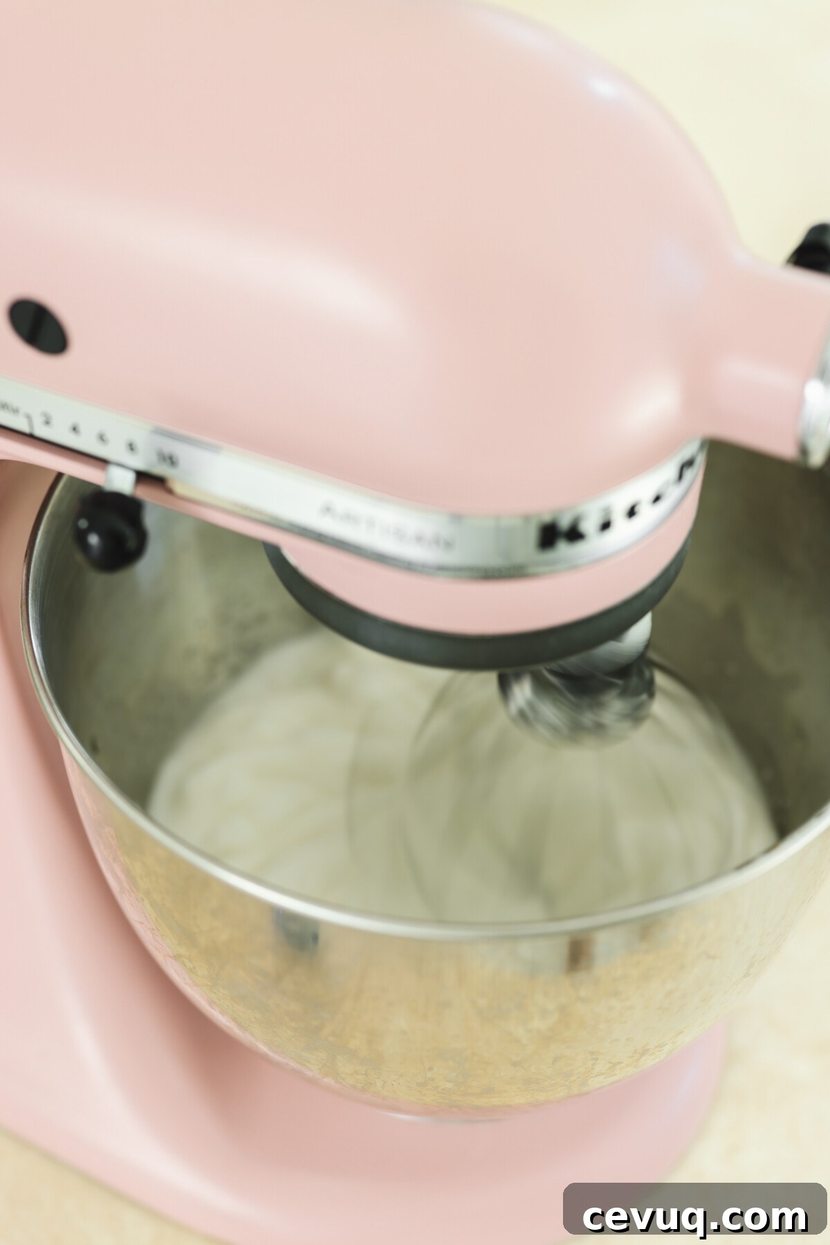 a stand mixer whipping up aquafaba