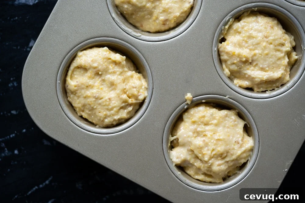 Unbaked low carb cornbread in a muffin tin