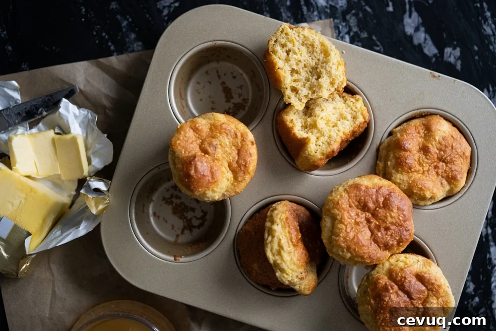 Freshly baked low carb cornbread in a muffin tin with butter 