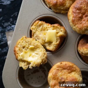Freshly baked low carb cornbread with cornmeal and a pat of butter melting through