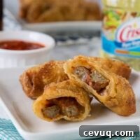 Meatball Sub Egg Rolls - all the flavors of your favorite meatball sub sandwich in a crispy egg roll. Serve with marinara sauce for dipping and you have the perfect appetizer or snack!