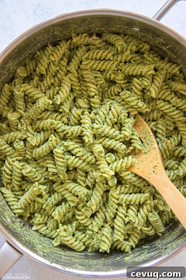 overhead shot of a pot with creamy cilantro pasta 