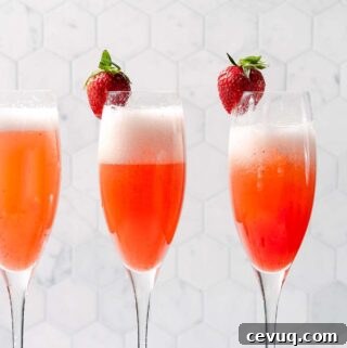 three glasses of strawberry mimosas