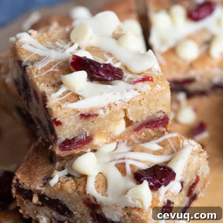 A stack of cranberry white chocolate blondies.