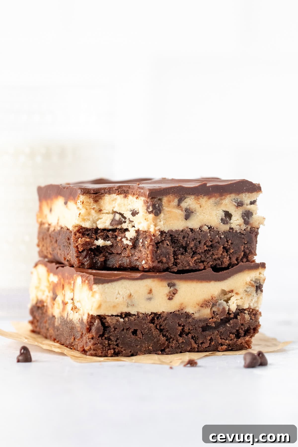 Cookie Dough Brownies Recipe: Fudgy Brownies with Edible Cookie Dough 8 Two cookie dough brownies on top of one another, with a bite taken out of the top brownie