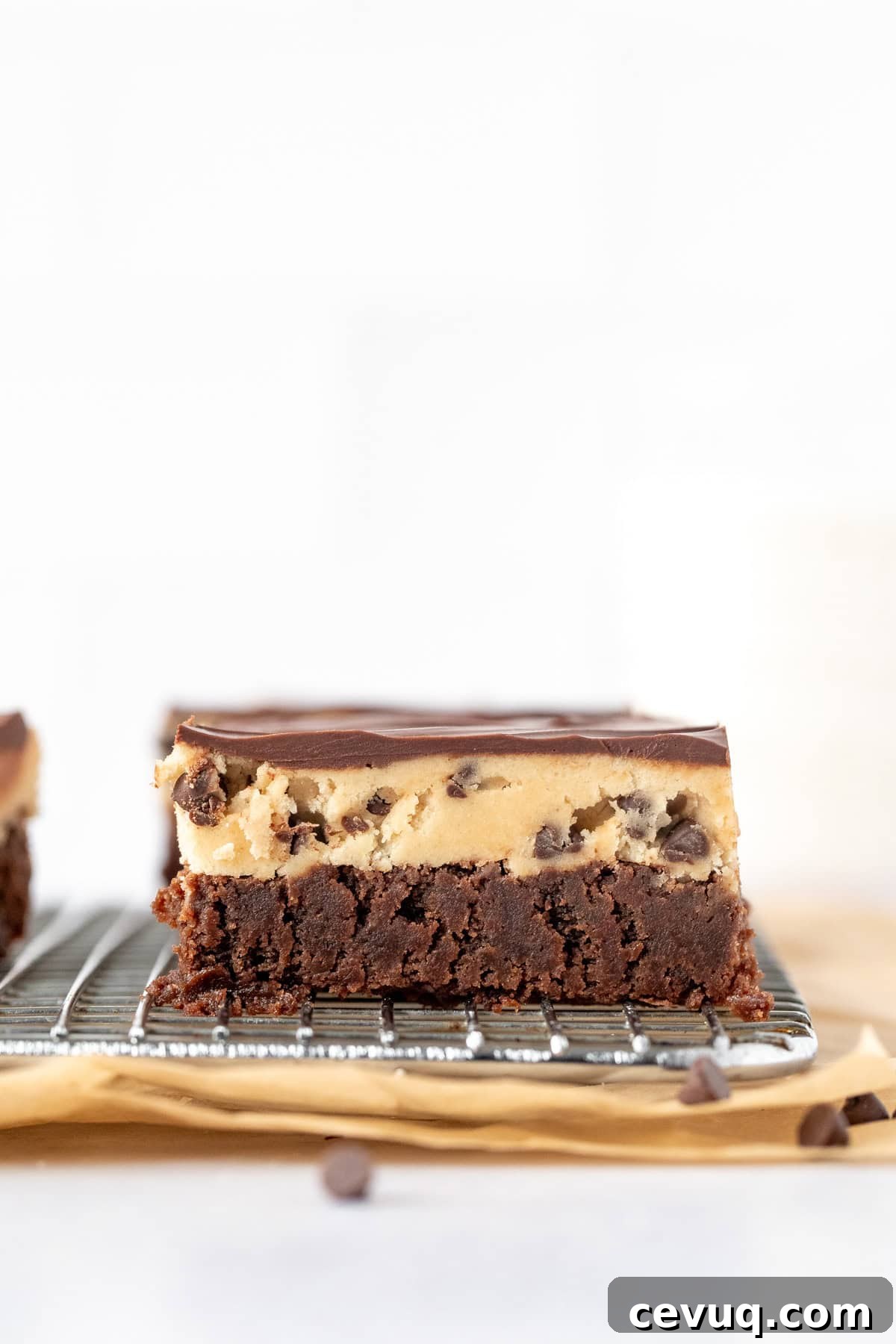 Cookie Dough Brownies Recipe: Fudgy Brownies with Edible Cookie Dough 4 Brownie with edible cookie dough layer and chocolate topping on a cooling rack