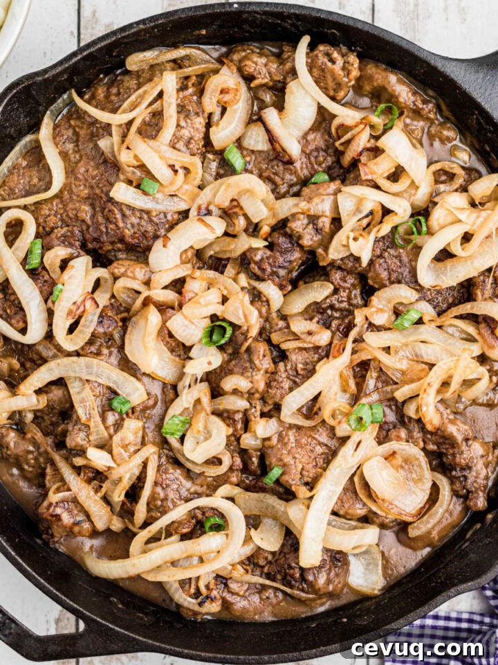 Cast iron pan full of liver and onions.