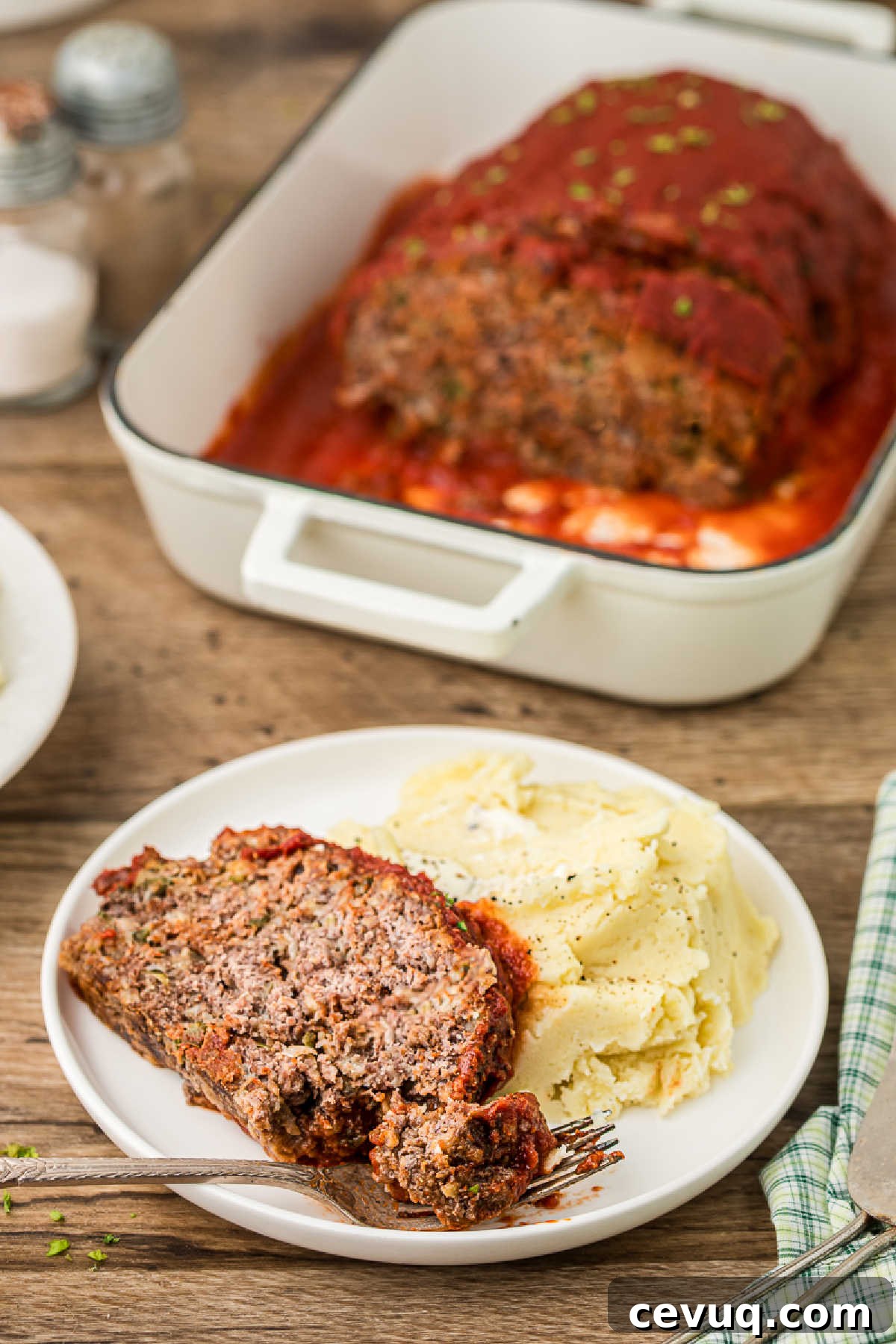 Dished up plate of Cajun meatloaf with mashed potatoes.
