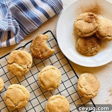 snickerdoodle recipe without cream of tartar on white plate with tray of snickerdoodle cookies in background