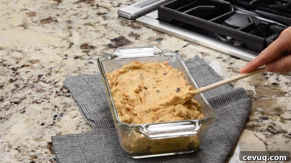 sweet potato bread batter in a loaf pan ready to bake
