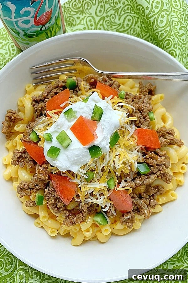 bowl of taco mac and cheese with a beer