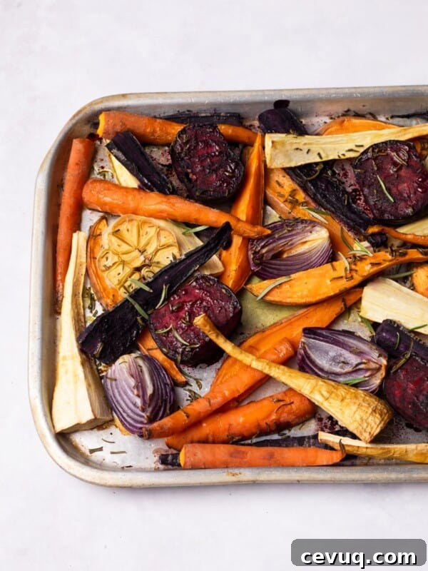 Crispy Roasted Parsnips with Honey and Thyme 9 Roasted Root Vegetables on a roasting tray.