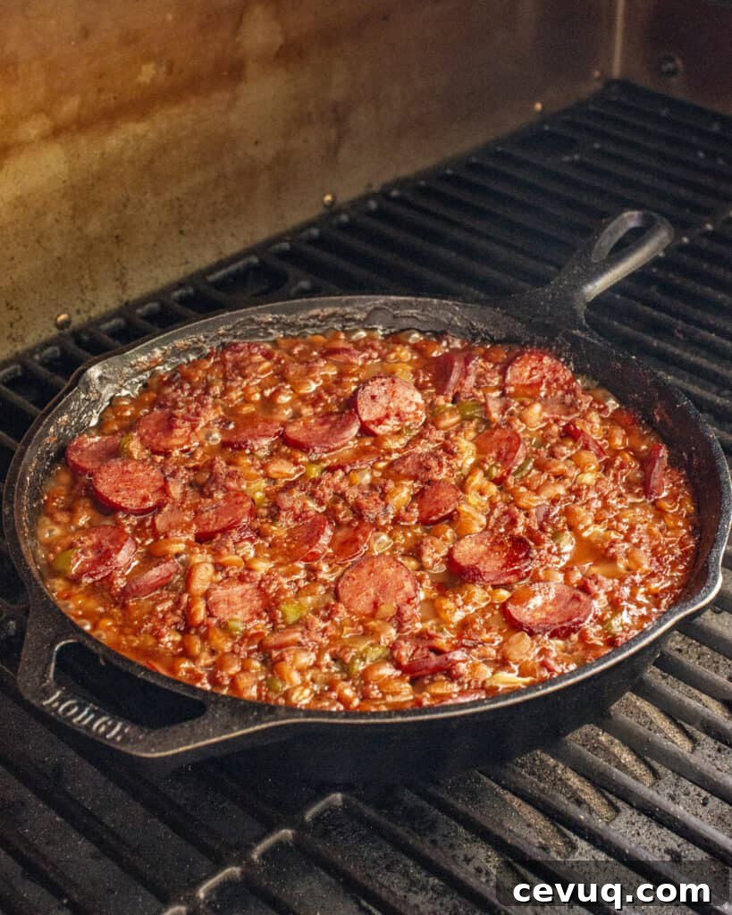 loaded baked beans in a cast iron pan 