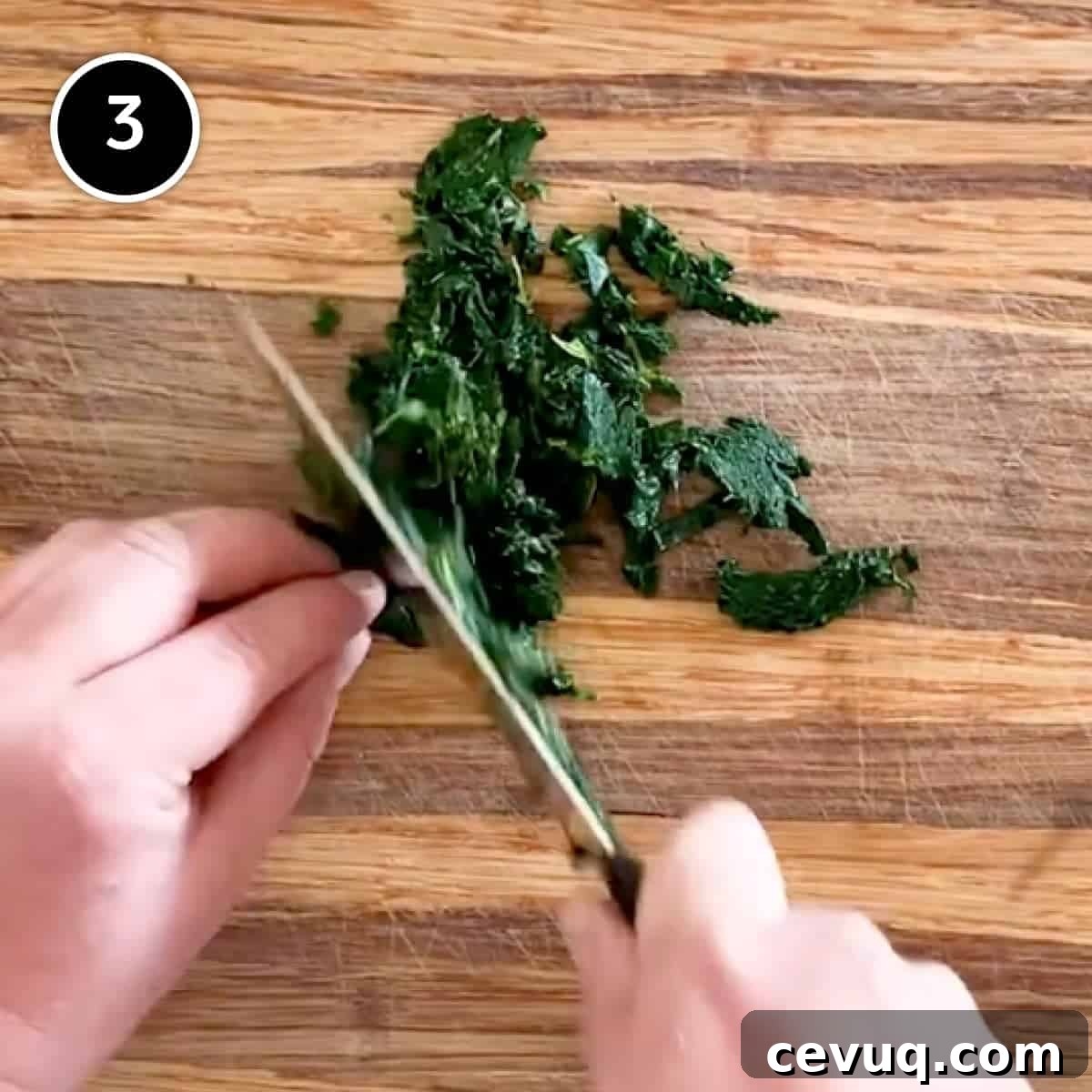 Chopping cavolo nero cabbage on a wooden board