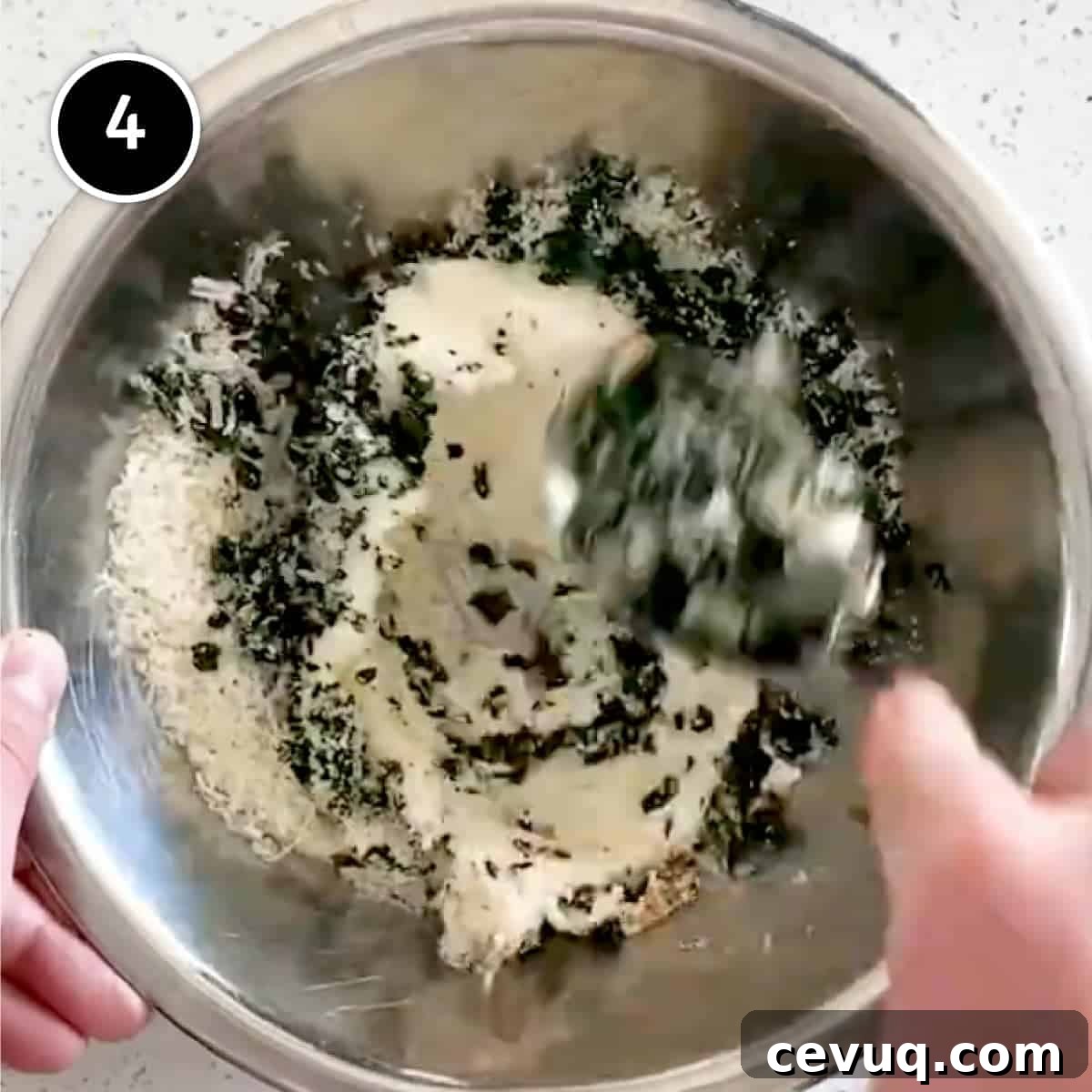 Stirring together the ingredients for cavolo nero & ricotta mezzelune