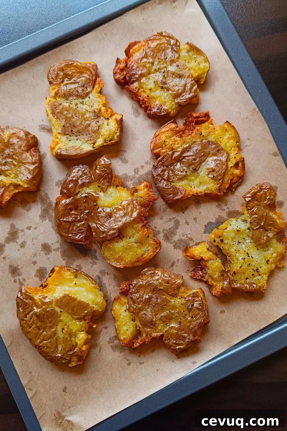 Image showing crispy smashed potatoes arranged on a tray.